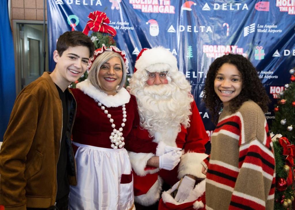Disney Stars Joshua Rush and Kylee Russell Spread Holiday Cheer at the 8th Annual Holiday in the Hangar by Delta Airlines