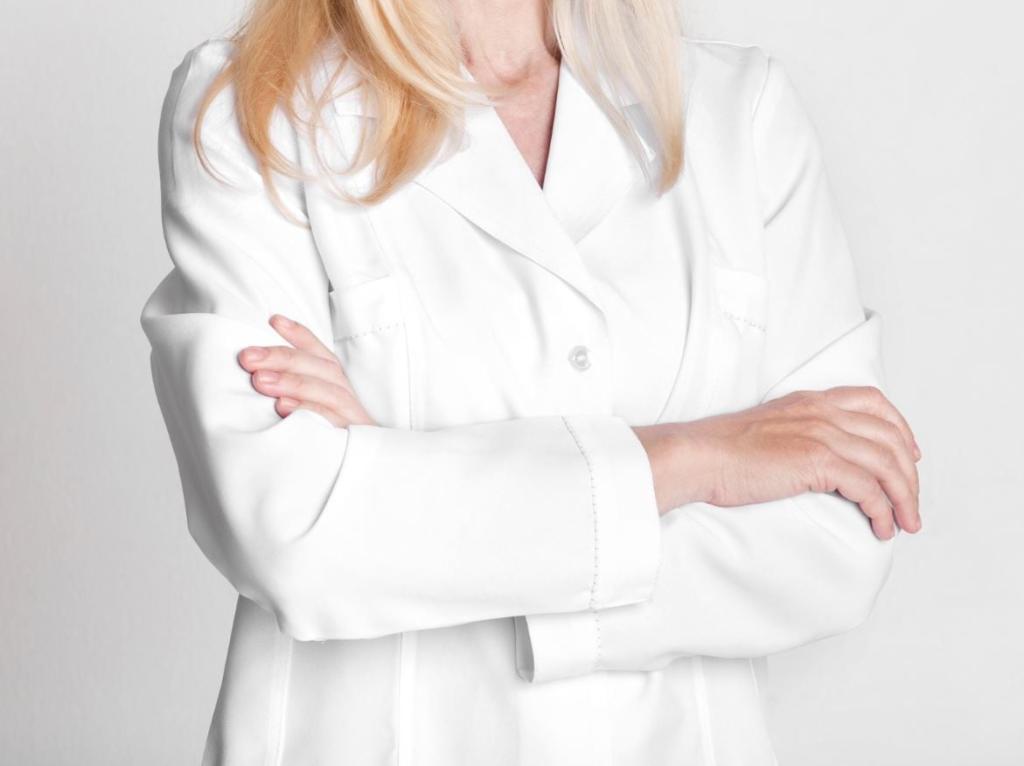 female doctor in white uniform with crossed arms HJQPNJM