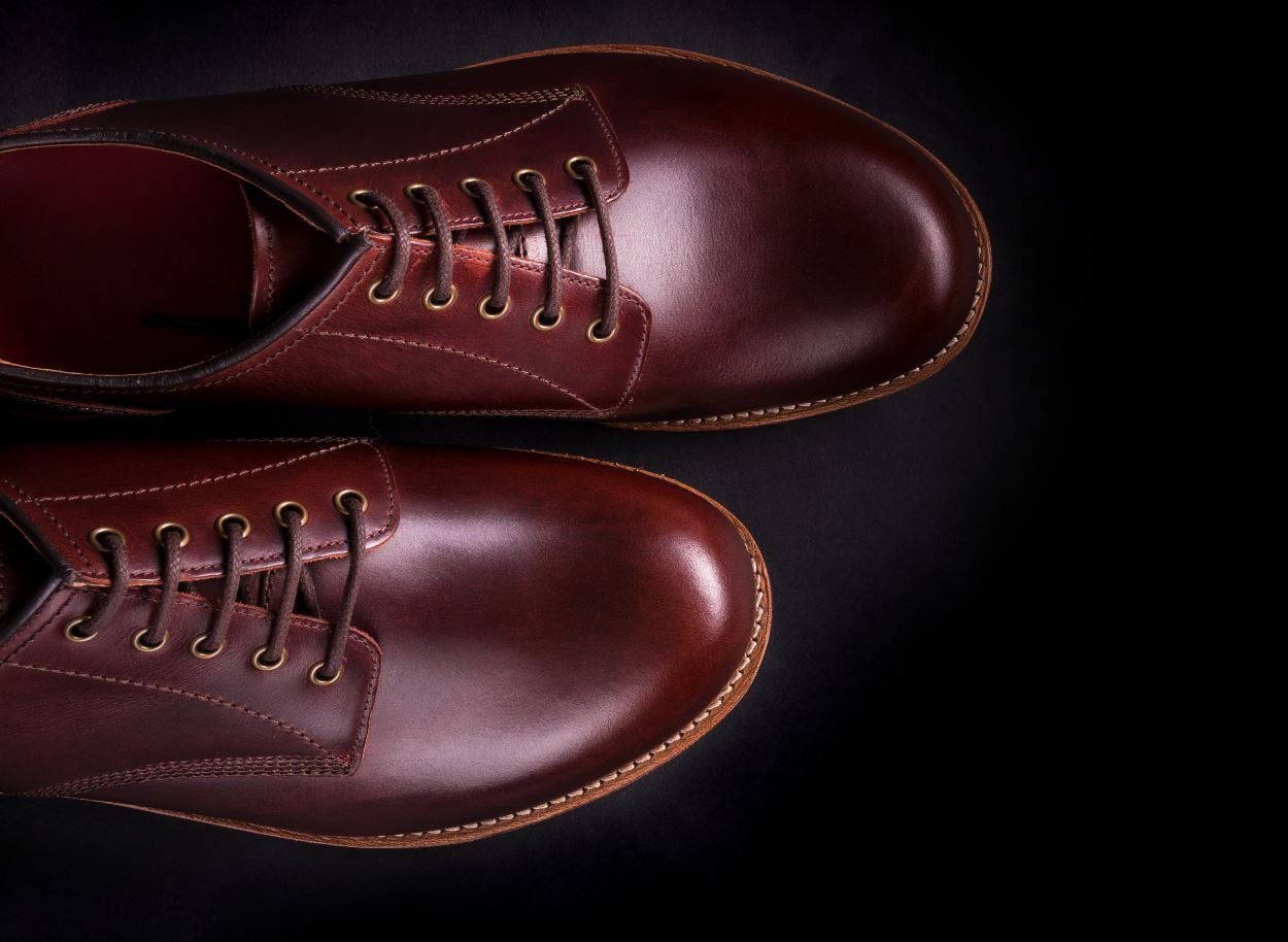 brown oxford shoes on black background top view co PG5CQF2