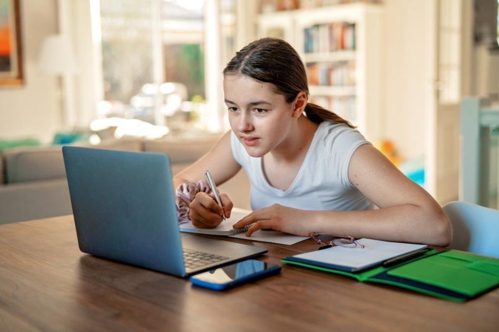 teenager girl studying online at home looking at laptop at quarantine isolation period during t20 ZYK6do